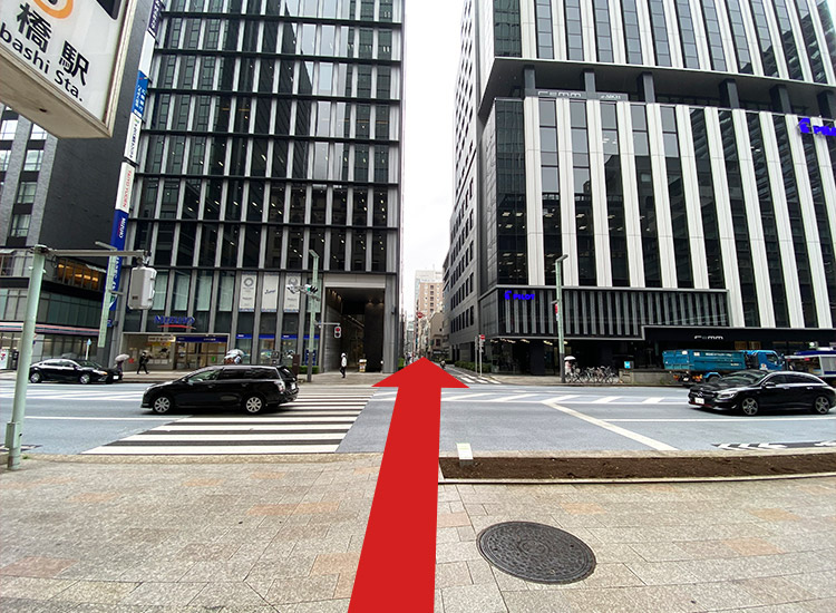 Cross the pedestrian crossing and go to the alley at the right of Mizuho Securities again.