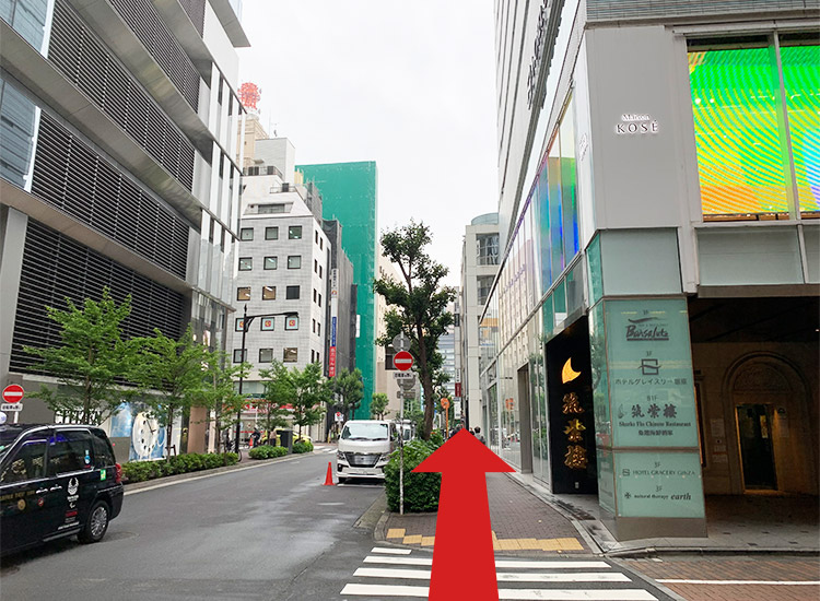 Go straight. You will see the entrance to the parking lot of "GINZA SIX" on the left.