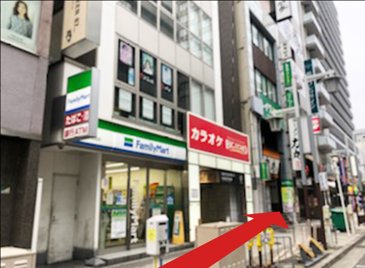 Keep going straight. The FamilyMart and Karaoke BIC ECHO on your left will be your midway landmarks.