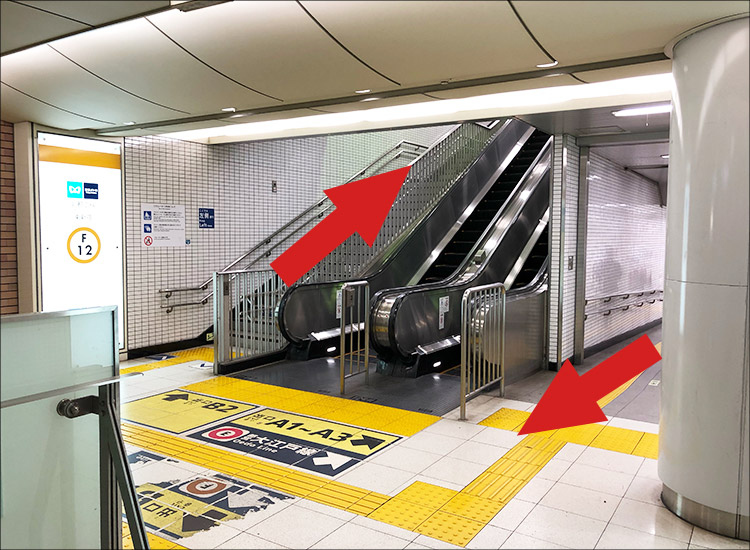 Make a U-turn by getting on the escalator to go up.