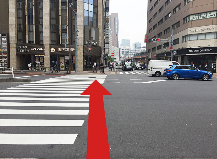 Cross the pedestrian crossing on the main street. (Your landmarks are Ginza Lion and Ringer Hut.)