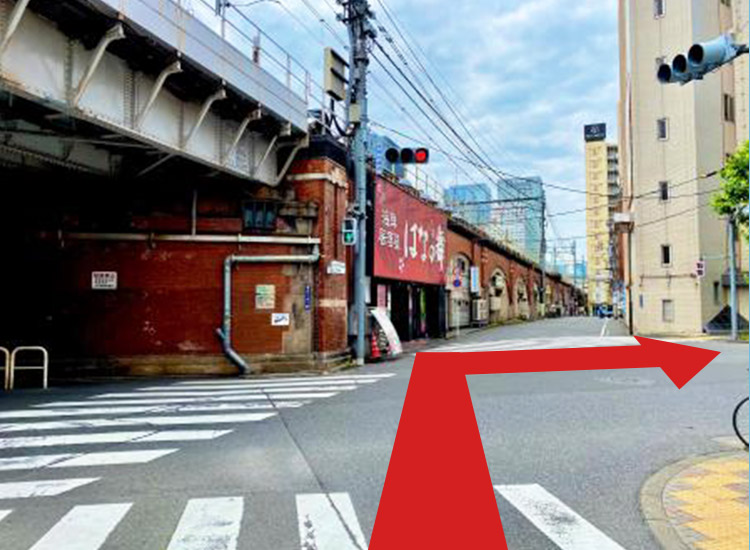Turn right at the intersection where there is a sign for an izakaya (Japanese-style tavern).