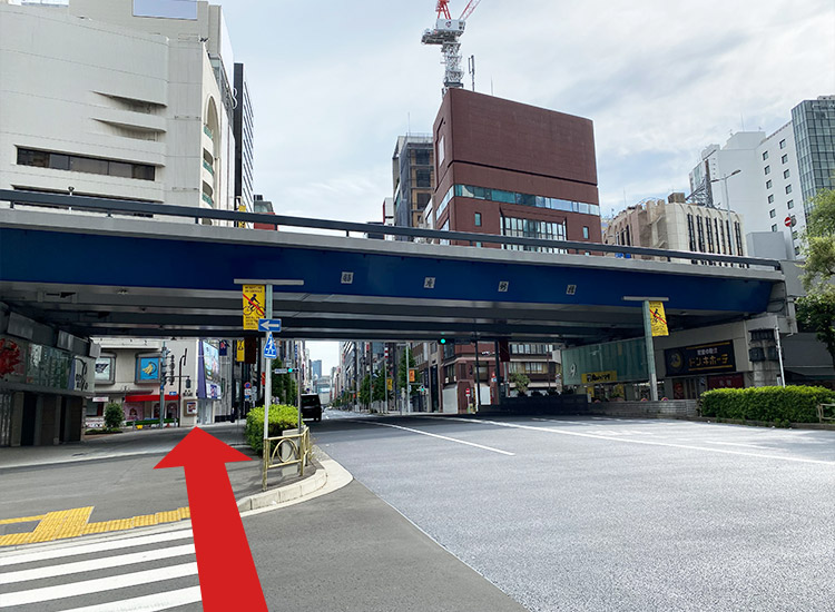 Pass under the Tokyo Metropolitan Expressway and walk straight on National Route 15 (Chuo-dori Street).