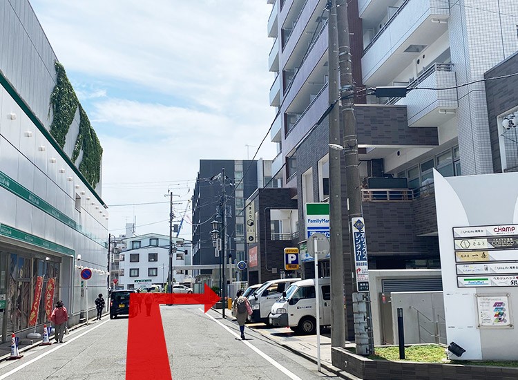 Walk for about 50m between the Pachinko parlor and FamilyMart and then turn right at the end.