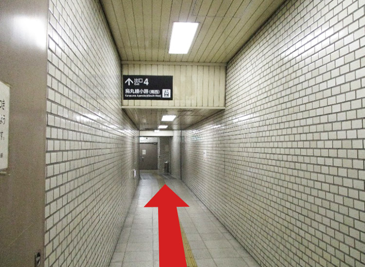 Get on the elevator at the end of the passageway.
