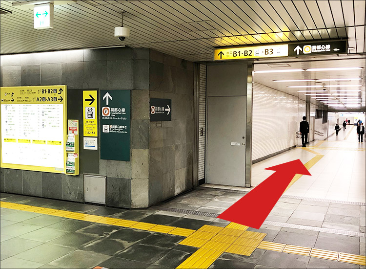 Go straight through the passageway in front of you.